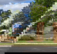 The Fossilised Forest Sculpture - Accommodation NSW